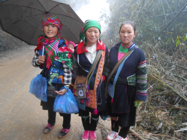 3 women and baby following
